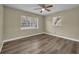 Here's a bedroom with wood floor and two windows that provide ample amounts of natural light at 1416 E 20Th St, Sanford, FL 32771