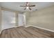 The bedroom features wood floors, a double door closet, and access to another room or bathroom at 1416 E 20Th St, Sanford, FL 32771