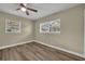 This bedroom features wood floors and large windows that give the room ample natural light at 1416 E 20Th St, Sanford, FL 32771