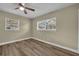 Bedroom with wood look flooring and two windows at 1416 E 20Th St, Sanford, FL 32771