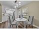 Cozy dining area with a round table, pendant lighting, and wood-look floors at 1416 E 20Th St, Sanford, FL 32771