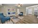 Inviting living room with wood-look floors, comfortable seating, and contemporary decor at 1416 E 20Th St, Sanford, FL 32771