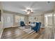 Inviting living room with neutral tones, stylish rug, and comfortable blue seating at 1416 E 20Th St, Sanford, FL 32771