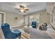Cozy living room with neutral paint, comfortable seating, stylish rug and a door to the front porch at 1416 E 20Th St, Sanford, FL 32771