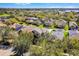 A beautiful aerial shot of a suburban neighborhood surrounded by lush greenery and trees at 14554 Black Cherry Trl, Winter Garden, FL 34787