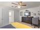 This bedroom features a ceiling fan, closet, and a view of the backyard at 14554 Black Cherry Trl, Winter Garden, FL 34787