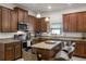 Modern kitchen featuring a central island with bar seating and ample cabinet space at 14554 Black Cherry Trl, Winter Garden, FL 34787