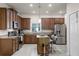 Well-equipped kitchen featuring stainless steel appliances, granite countertops, and a central island at 14554 Black Cherry Trl, Winter Garden, FL 34787