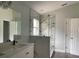 Modern bathroom featuring a glass-enclosed shower and double sink vanity at 14954 Lady Victoria Blvd, Orlando, FL 32826