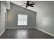 Bright bedroom featuring a vaulted ceiling, wood-look floors, and a ceiling fan at 14954 Lady Victoria Blvd, Orlando, FL 32826