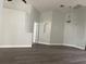 Spacious living room boasts modern hardwood floors and neutral wall color at 14954 Lady Victoria Blvd, Orlando, FL 32826