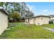 This spacious backyard has mature trees, stepping stones and a playset at 1622 Dolphin Dr, St Cloud, FL 34771