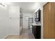 Bathroom featuring a black vanity with a vessel sink, a toilet, tiled floor, and a shower/tub combo at 1622 Dolphin Dr, St Cloud, FL 34771