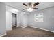 A bedroom with a ceiling fan, carpet floors, a window, a closet, and gray painted walls at 1622 Dolphin Dr, St Cloud, FL 34771