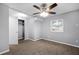 Bedroom with neutral walls, carpet flooring, ceiling fan, window, and closet space at 1622 Dolphin Dr, St Cloud, FL 34771