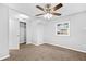 Bedroom with neutral walls, carpet flooring, ceiling fan, window, and closet space at 1622 Dolphin Dr, St Cloud, FL 34771