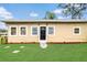 Charming single-story home with a well-maintained lawn and welcoming front entrance at 1622 Dolphin Dr, St Cloud, FL 34771
