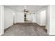 Spacious living room featuring neutral paint, plush carpeting, and a ceiling fan with light fixture at 1622 Dolphin Dr, St Cloud, FL 34771
