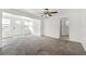 Inviting living room showcasing new carpeting, bright paint, and a front entrance with natural light at 1622 Dolphin Dr, St Cloud, FL 34771