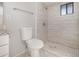 Bathroom features a tiled shower and floor with a modern toilet at 184 Dublin Dr, Lake Mary, FL 32746