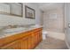 Well-lit bathroom features a double sink vanity and tiled shower/tub combination at 184 Dublin Dr, Lake Mary, FL 32746