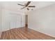 Bedroom with wood floors, a ceiling fan, and a closet with bi-fold doors at 184 Dublin Dr, Lake Mary, FL 32746