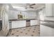 Well-lit kitchen featuring stainless steel appliances, white cabinets, and ample countertop space at 184 Dublin Dr, Lake Mary, FL 32746