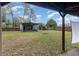 Fully-fenced yard with screened in porch and outdoor movie theatre at 200 Avenue C, Chuluota, FL 32766