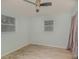 Bedroom features natural light, wood look tile flooring and neutral paint at 200 Avenue C, Chuluota, FL 32766