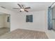 Bedroom features natural light, ceiling fan, mirror closet and tile flooring at 200 Avenue C, Chuluota, FL 32766