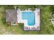 Aerial view of community pool area with lounge chairs and a covered pavilion at 2073 Home Again Rd, Apopka, FL 32712