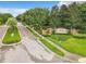 View of the Oak Hill Reserve community entrance featuring lush landscaping and brick-paved streets at 2073 Home Again Rd, Apopka, FL 32712