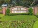 Attractive Oak Hill Reserve community sign with manicured landscaping and colorful flowerbeds at 2073 Home Again Rd, Apopka, FL 32712