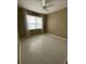 Relaxing bedroom filled with natural light, enhanced by neutral walls, tile flooring, and soft curtains at 2475 Verde View Dr, Apopka, FL 32703