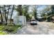 View of the cluttered front yard with multiple vehicles parked on the property at 2516 Cannon St, Lakeland, FL 33815