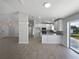 Well-lit kitchen featuring white cabinetry, stainless steel appliances, and a breakfast bar at 2720 Settlers Trl, St Cloud, FL 34772