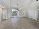 Bright and airy living room with tile floors, large arched window and open floor plan at 2720 Settlers Trl, St Cloud, FL 34772