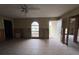 Living room featuring tile flooring, a fan, and traditional style windows at 2955 Banyan Ln, Lakeland, FL 33805