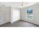 This bedroom has carpet, ceiling fan, and a window overlooking the yard and closet with double doors at 30 Hemlock Trce, Ocala, FL 34472