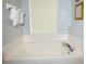 Bathroom featuring a large tub for relaxation and comfort at 301 Sandy Ridge Dr, Davenport, FL 33896