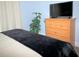 Bedroom features a dresser with a TV, providing a relaxing retreat at 301 Sandy Ridge Dr, Davenport, FL 33896