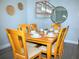 Charming dining room area features wood table, seating for six, modern light fixture, and decorative accents at 301 Sandy Ridge Dr, Davenport, FL 33896