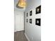 Hallway with modern lighting and elegant decor, creating an inviting space at 301 Sandy Ridge Dr, Davenport, FL 33896