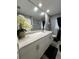 Modern bathroom with a large mirror, marble countertops, and updated fixtures at 307 N Oak Ave, Fort Meade, FL 33841