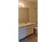 This bathroom features a large mirror over a vanity with white cabinets, toilet and shower at 325 Wymore Rd # 203, Altamonte Springs, FL 32714