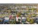 An overhead shot of the property nestled in a neighborhood with mature trees and manicured lawns at 3632 E Kaley Ave, Orlando, FL 32812