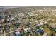 Expansive aerial view of a residential neighborhood featuring tree-lined streets and homes, some with private pools at 3632 E Kaley Ave, Orlando, FL 32812