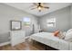 Cozy bedroom features a ceiling fan, desk, and a bright window at 3632 E Kaley Ave, Orlando, FL 32812