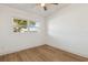 Empty bedroom featuring a ceiling fan and natural light from the window at 3632 E Kaley Ave, Orlando, FL 32812