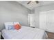 Comfortable bedroom features a ceiling fan, large closet, and a bright window at 3632 E Kaley Ave, Orlando, FL 32812